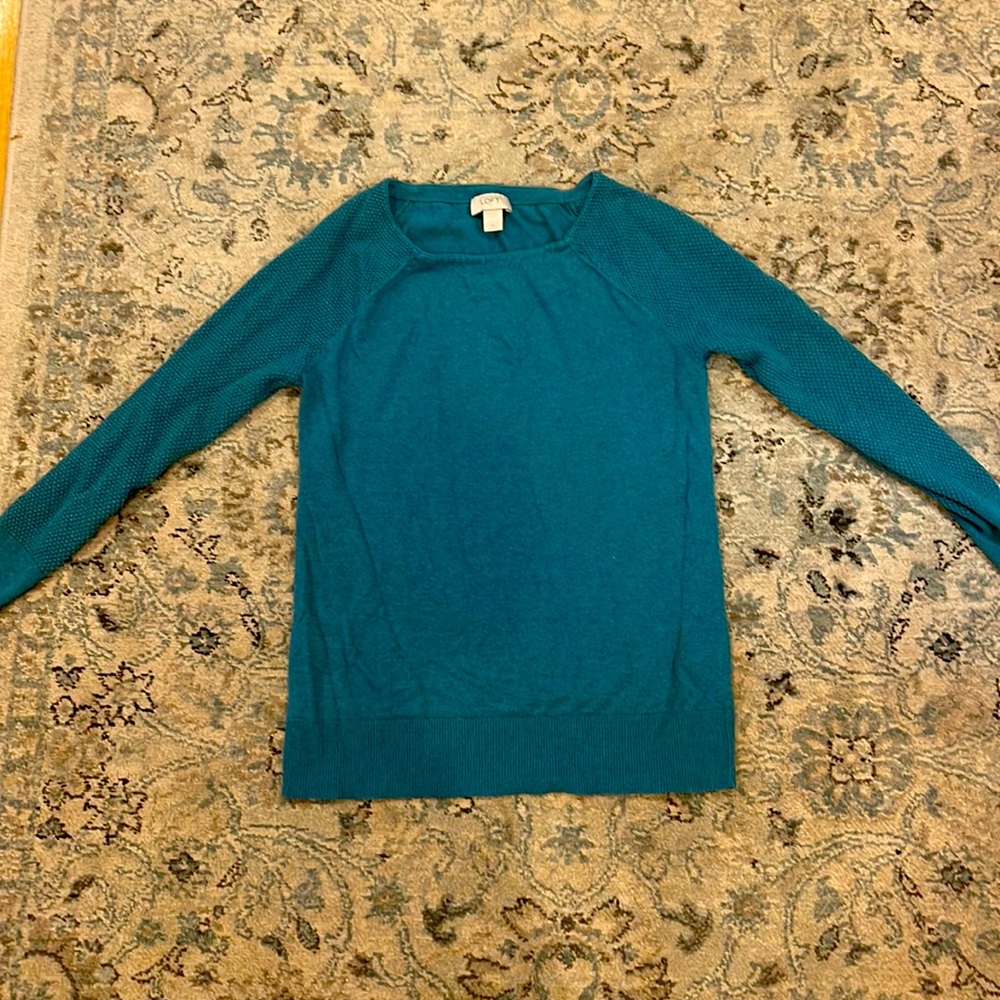 Aqua blue thin long sleeve sweater with ribbed arms.